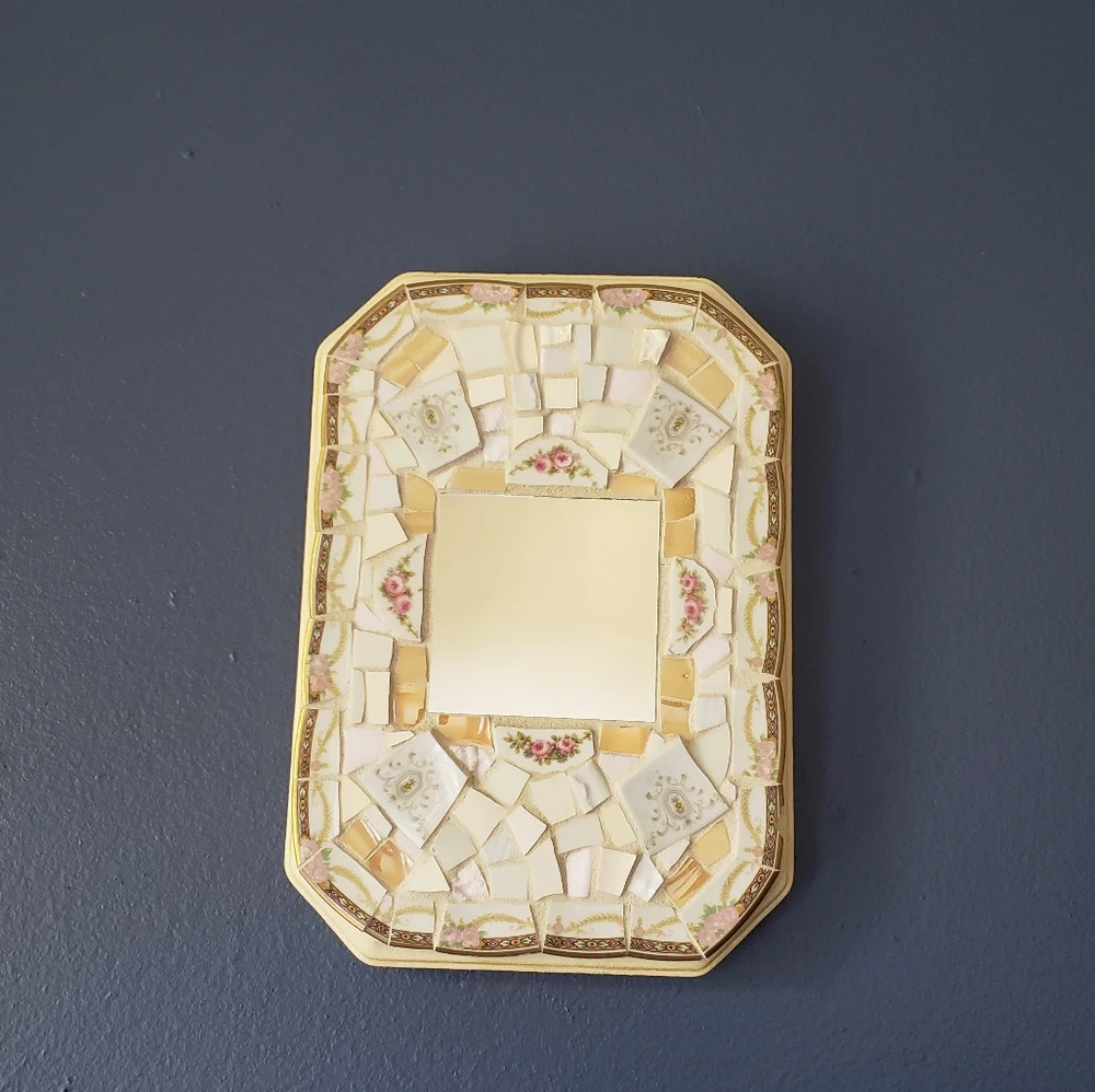 Genuine pique assiette mirror